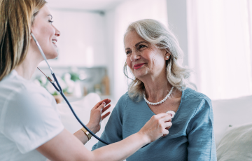 a senior woman getting her heart checked