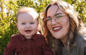 mother and baby smiling